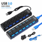 USB 3.0 hub with multiple ports and cables on a white background